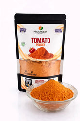 Fine textured dehydrated tomato powder close-up showing rich red color