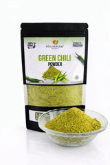 Fine dehydrator-dried green chili powder close-up showing natural color and texture